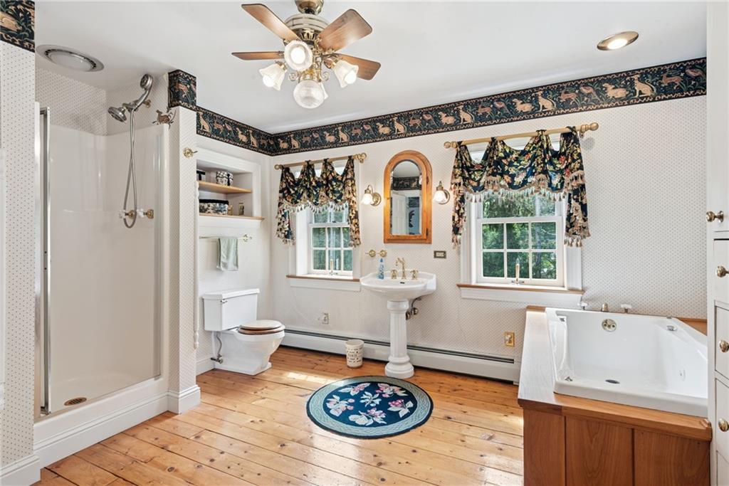 513 Austraw Road Ligonier, PA 15658 - Photo 36 of 50 a spacious bathroom with a tub a sink and a mirror