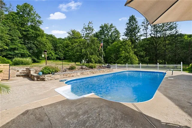 a view of a swimming pool with a patio