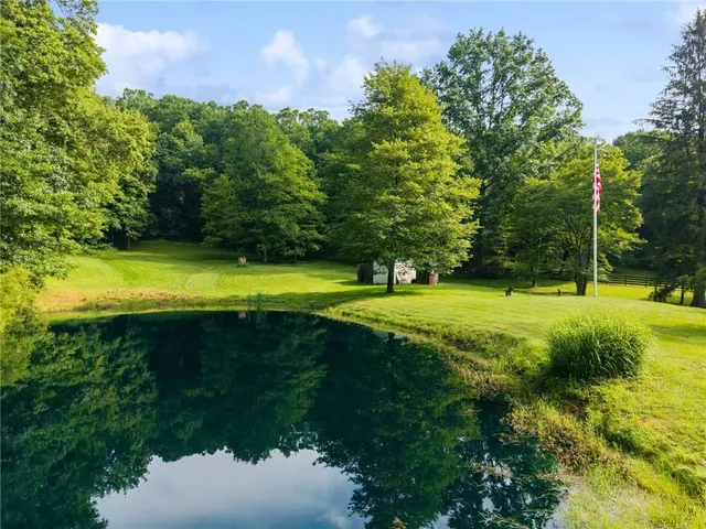 a view of a golf course with a lake