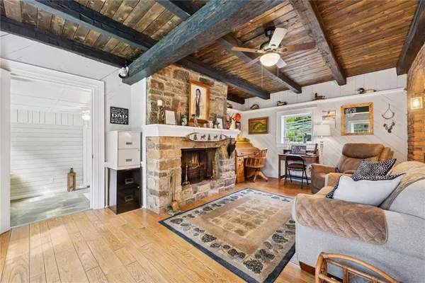 a living room with furniture and a fireplace