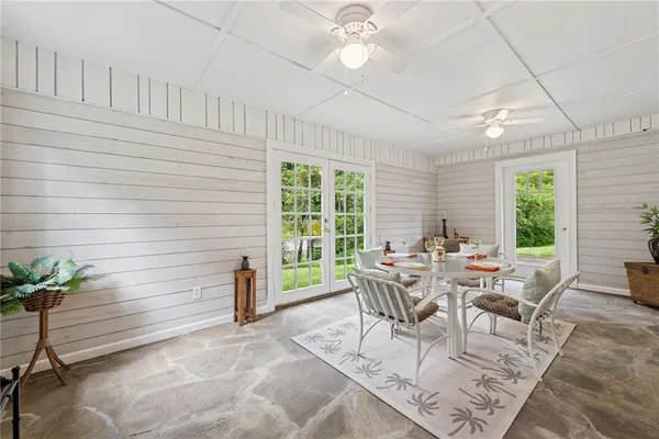 a view of a dining room with furniture window and outside view