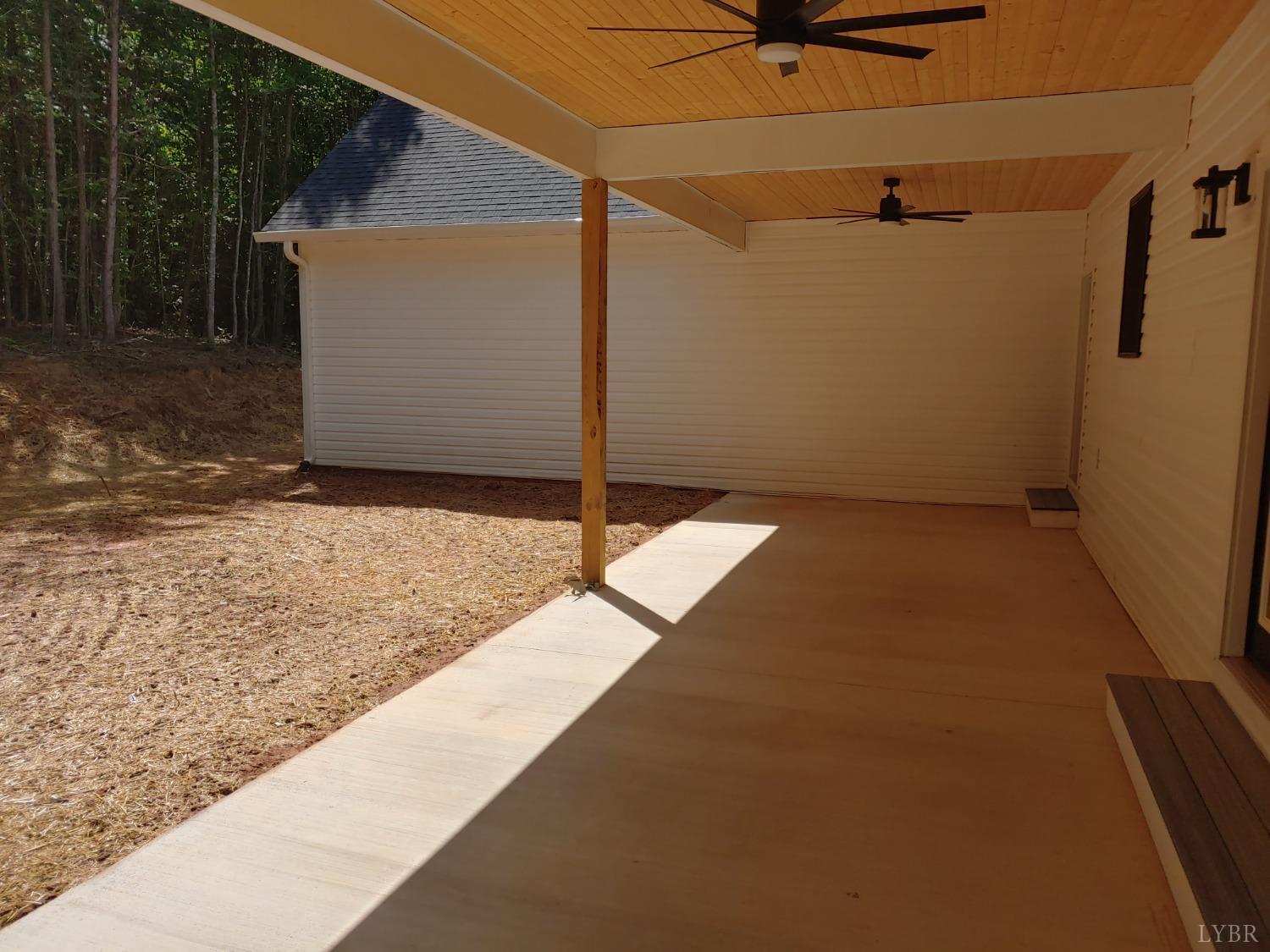 6230 Charlemont Road Goode, VA 24556 - Photo 16 of 99 a backyard of a house with a shaded area