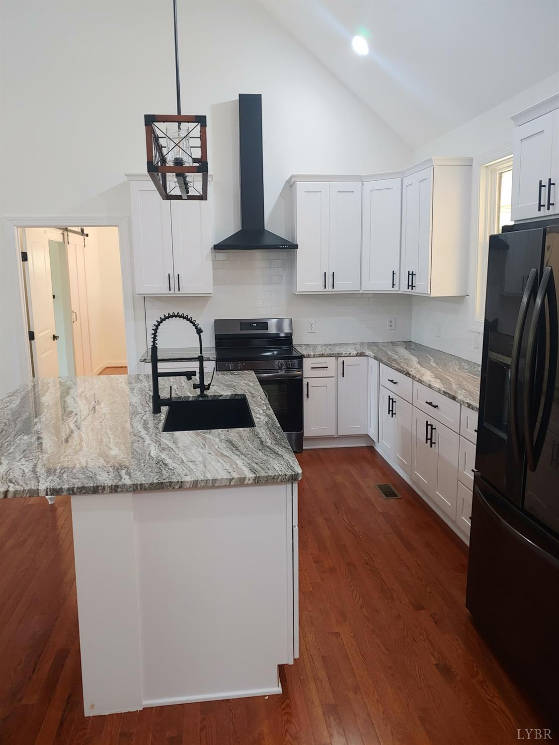 6230 Charlemont Road Goode, VA 24556 - Photo 25 of 99 a kitchen with stainless steel appliances granite countertop a sink stove and refrigerator