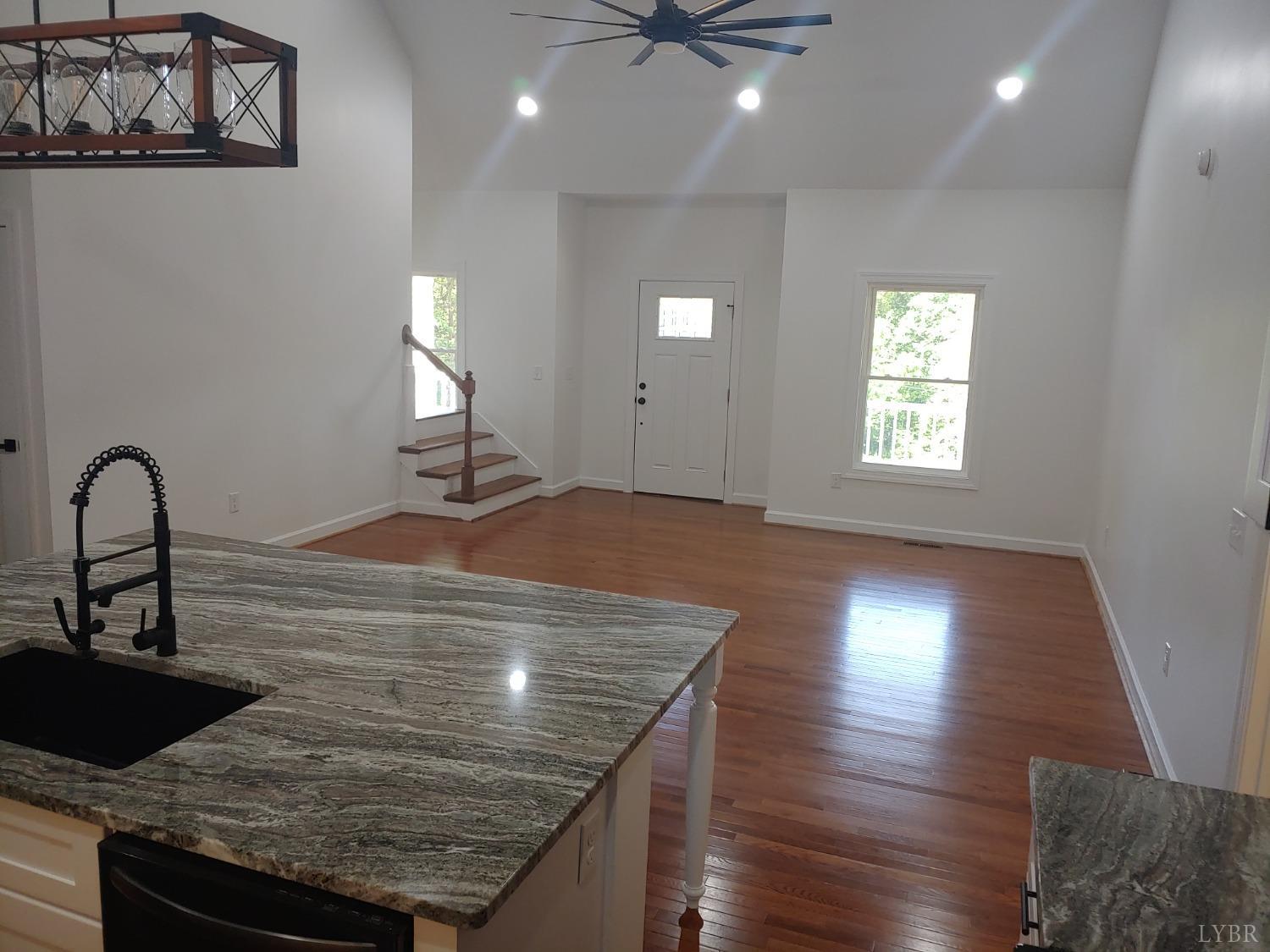 6230 Charlemont Road Goode, VA 24556 - Photo 28 of 99 a kitchen with kitchen island a sink stainless steel appliances and window