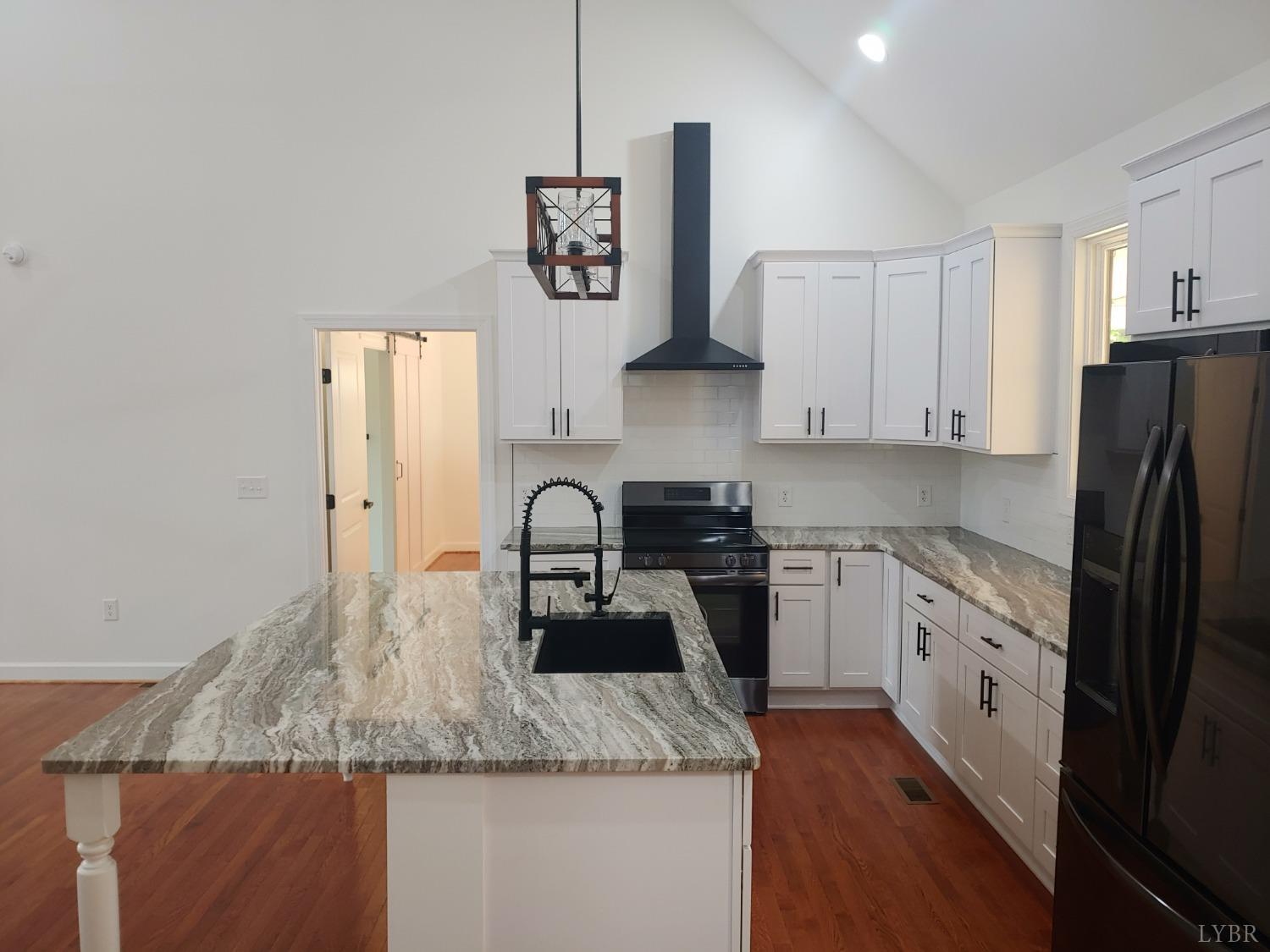6230 Charlemont Road Goode, VA 24556 - Photo 35 of 99 a kitchen with stainless steel appliances granite countertop a sink refrigerator and stove