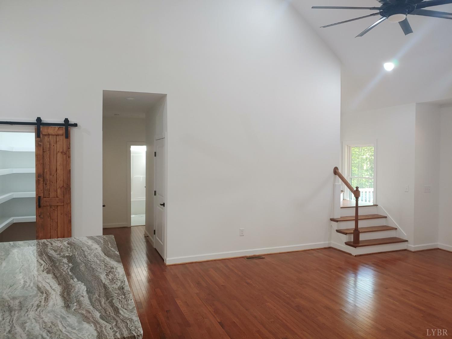 6230 Charlemont Road Goode, VA 24556 - Photo 39 of 99 a view of a room with wooden floor and a ceiling fan