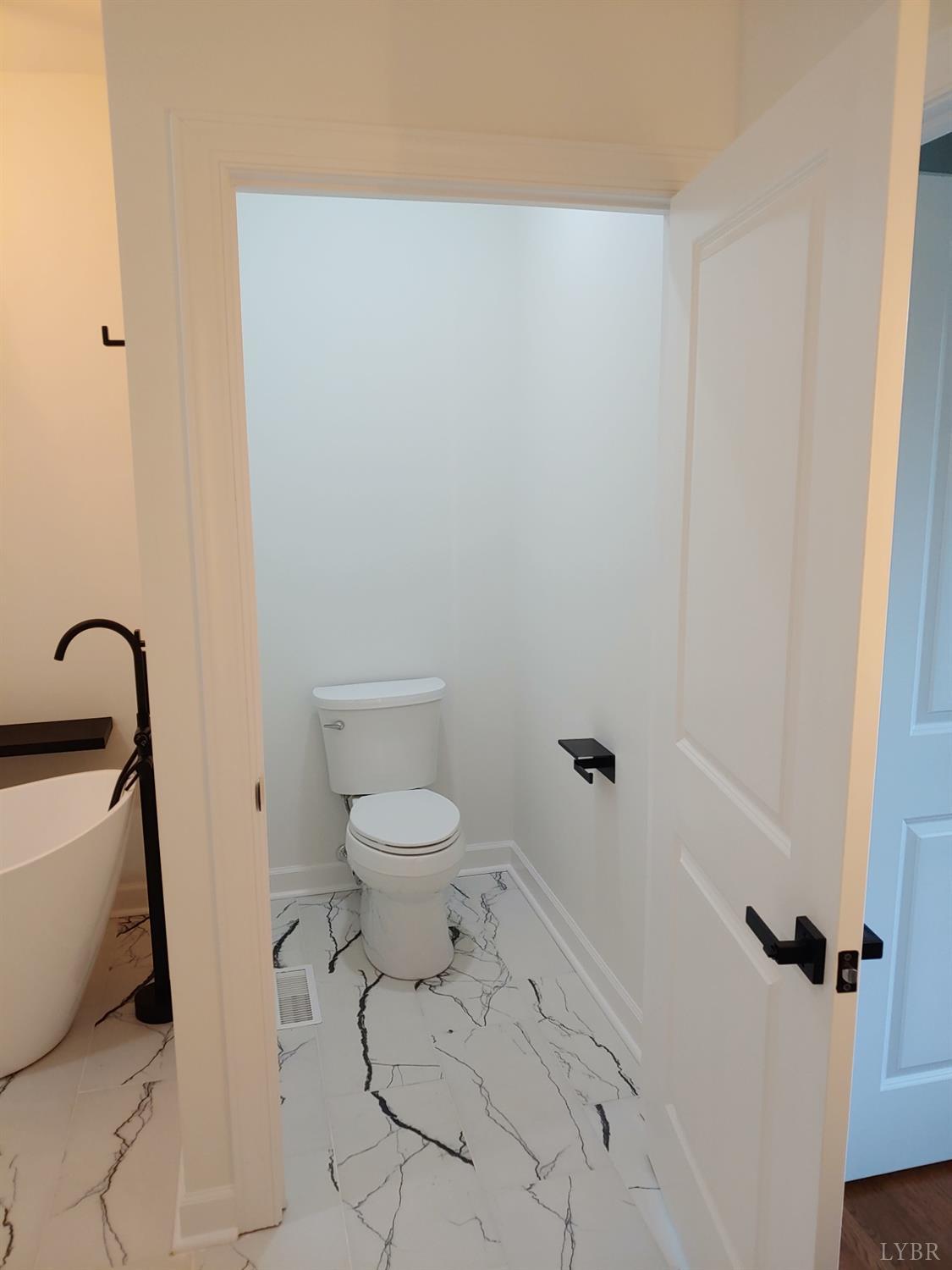 6230 Charlemont Road Goode, VA 24556 - Photo 45 of 99 a bathroom with a toilet and a sink