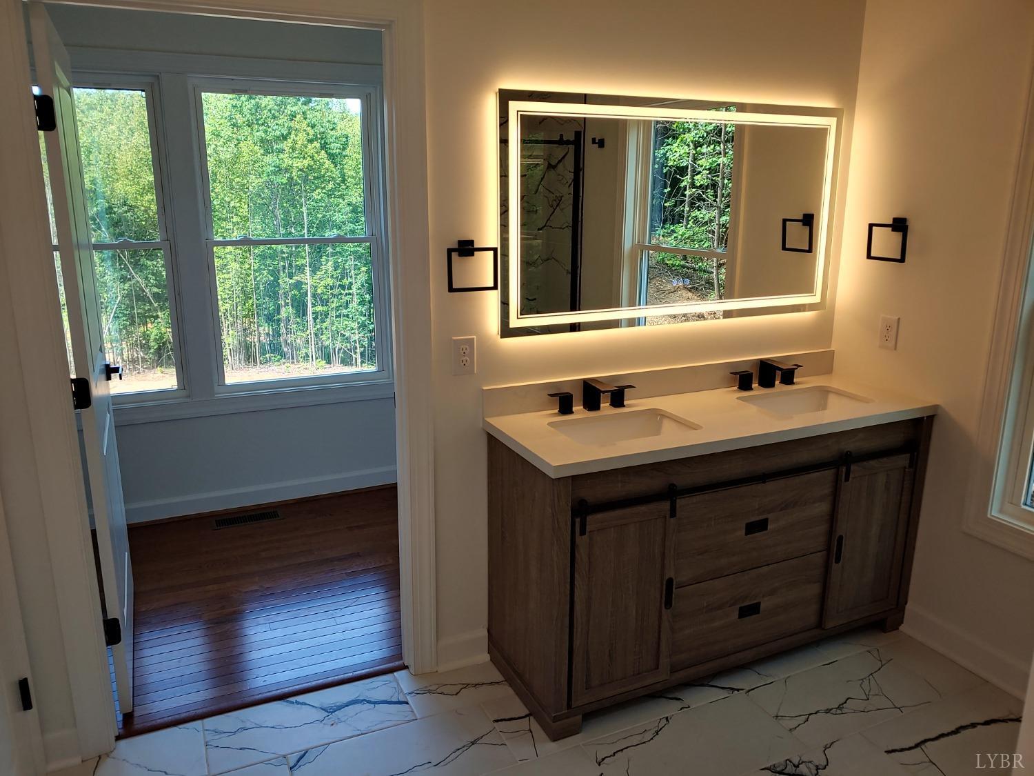 6230 Charlemont Road Goode, VA 24556 - Photo 46 of 99 a bathroom with a sink vanity and a mirror