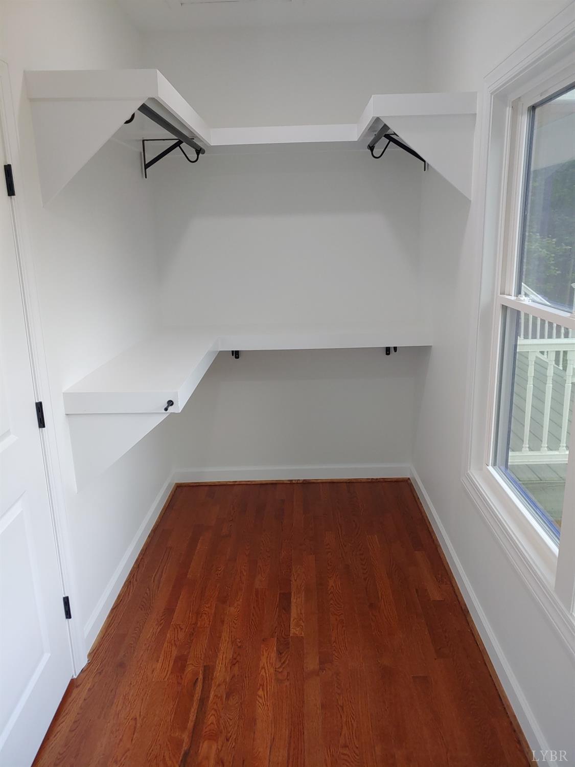 6230 Charlemont Road Goode, VA 24556 - Photo 50 of 99 a view of walk in closet with empty racks