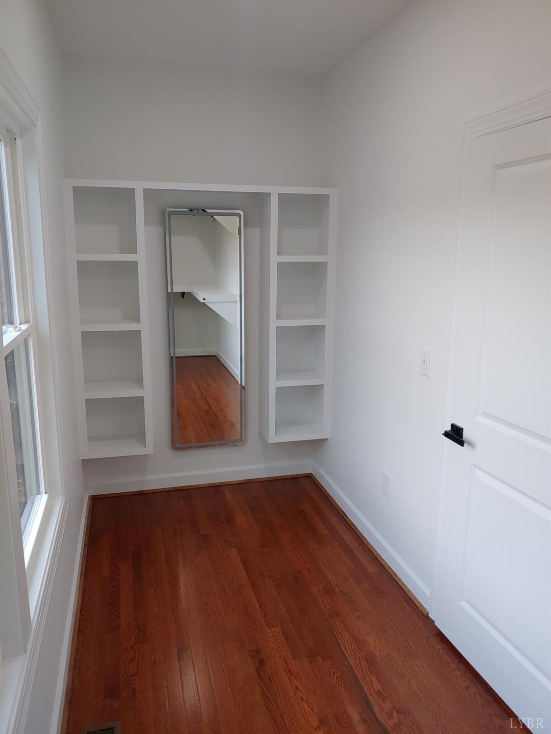 6230 Charlemont Road Goode, VA 24556 - Photo 51 of 99 a view of an empty room with a window and wooden floor