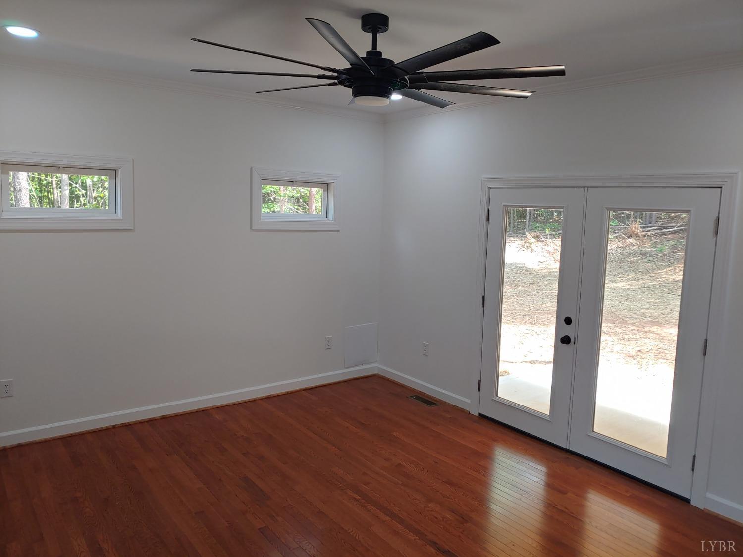 6230 Charlemont Road Goode, VA 24556 - Photo 56 of 99 a view of an empty room with a window and wooden floor