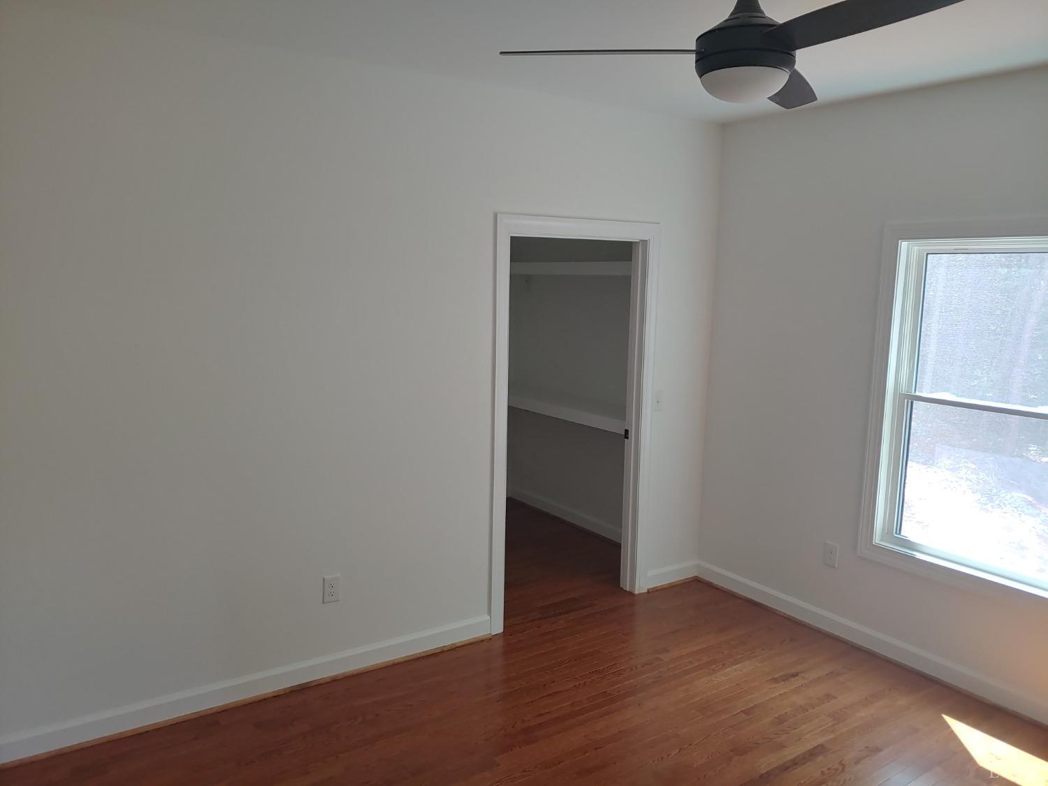 6230 Charlemont Road Goode, VA 24556 - Photo 60 of 99 an empty room with wooden floor and windows