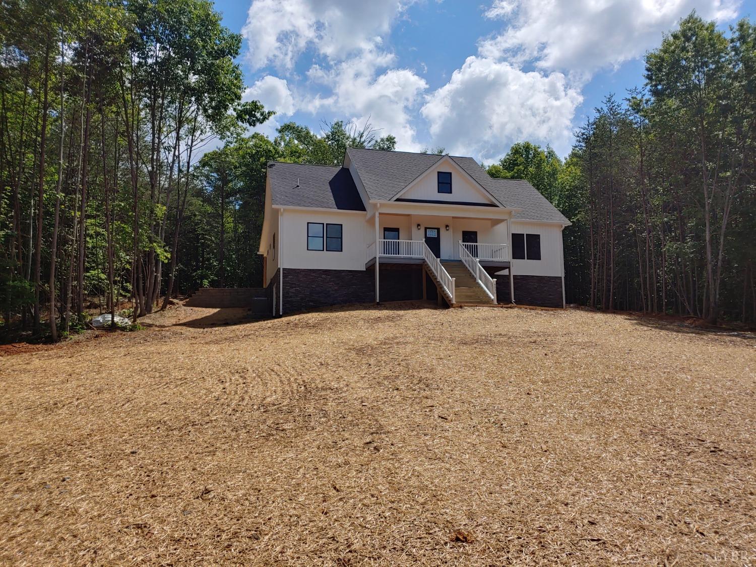 6230 Charlemont Road Goode, VA 24556 - Photo 6 of 99 a front view of a house with a yard