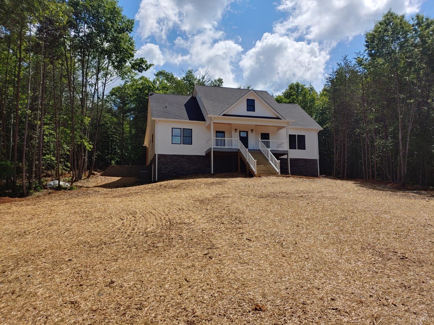 6230 Charlemont Road Goode, VA 24556 - Photo 7 of 99 a front view of a house with a yard