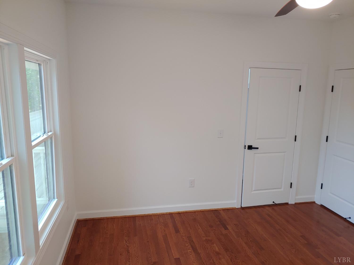 6230 Charlemont Road Goode, VA 24556 - Photo 75 of 99 a view of an empty room with wooden floor and a window