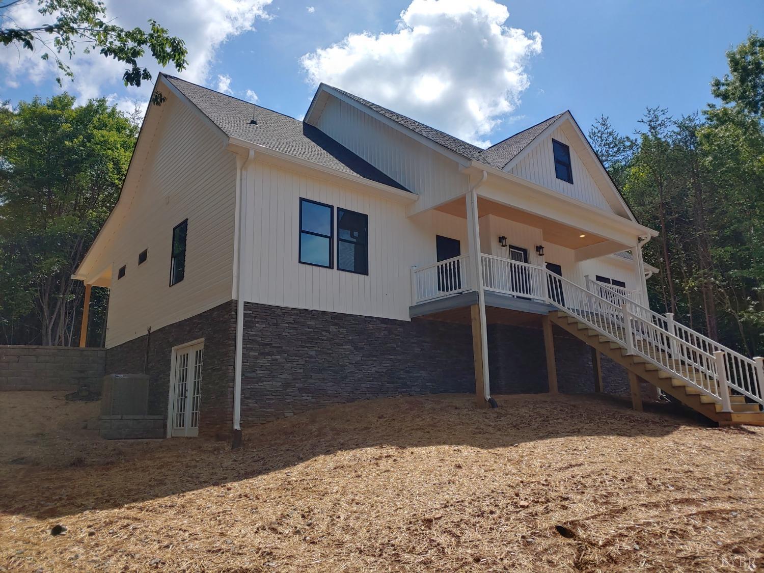 6230 Charlemont Road Goode, VA 24556 - Photo 8 of 99 a front view of a house with a yard