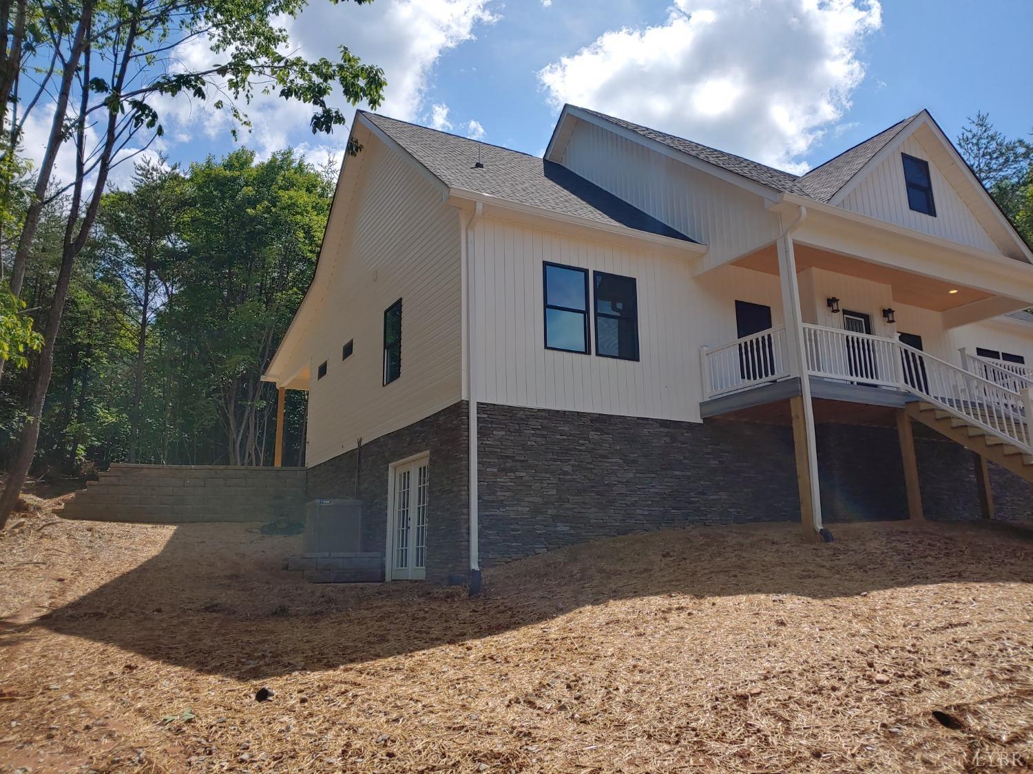 6230 Charlemont Road Goode, VA 24556 - Photo 9 of 99 a front view of a house with a yard
