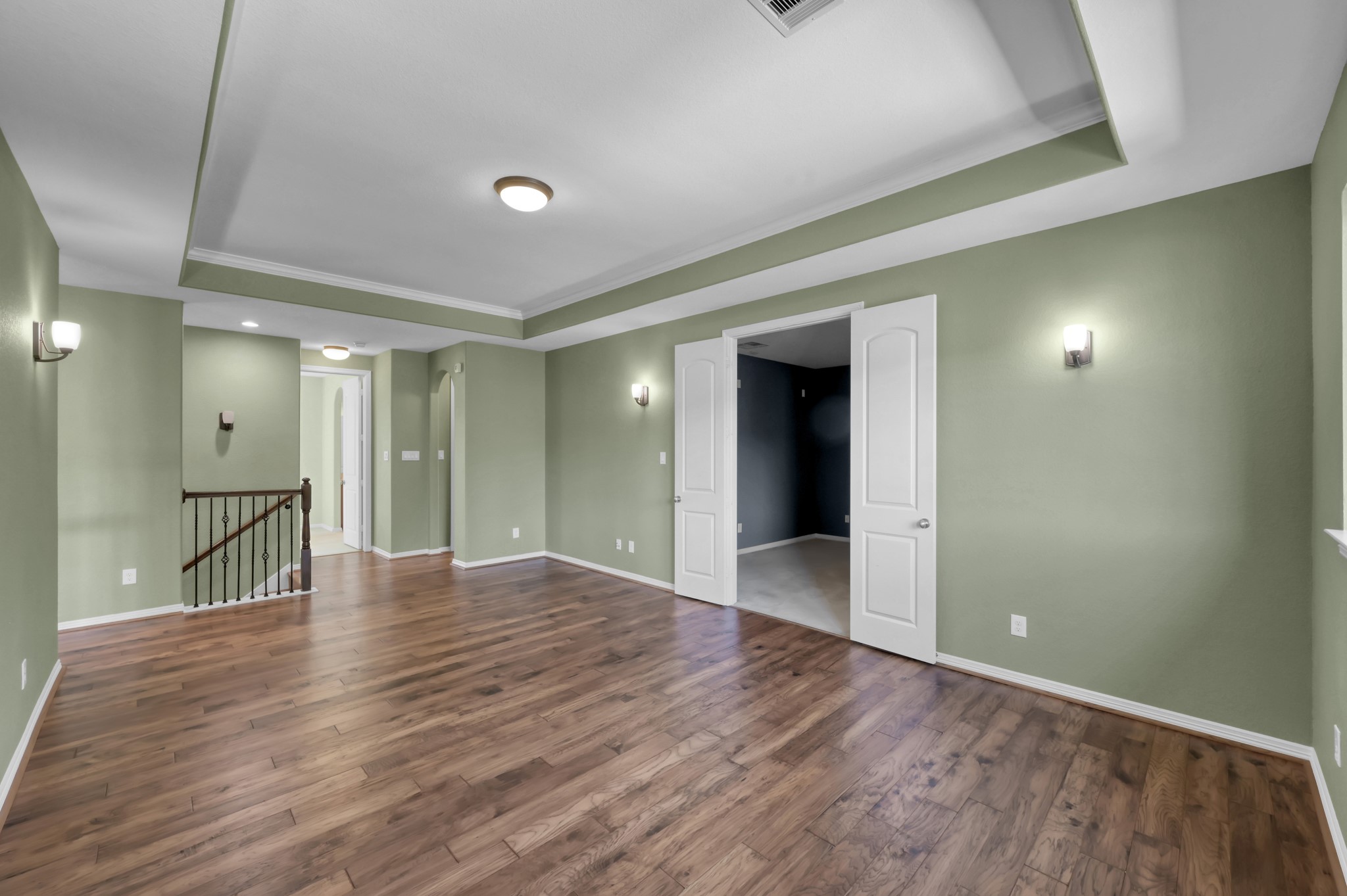 23219 Belted Kingfisher Trail Spring, TX 77389 - Photo 23 of 43 Upstairs, a large open flex space with continued wood flooring offers room to relax, work, or gather