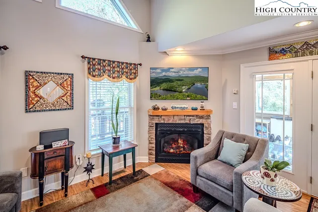a living room with furniture a window and a fireplace