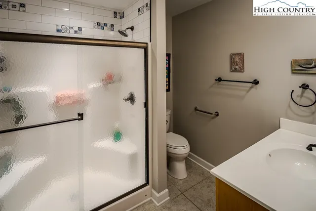 a white toilet sitting next to a bathroom sink