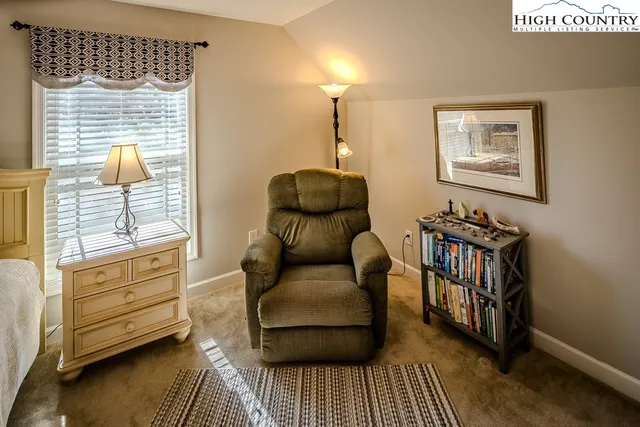 a bedroom with furniture and a window