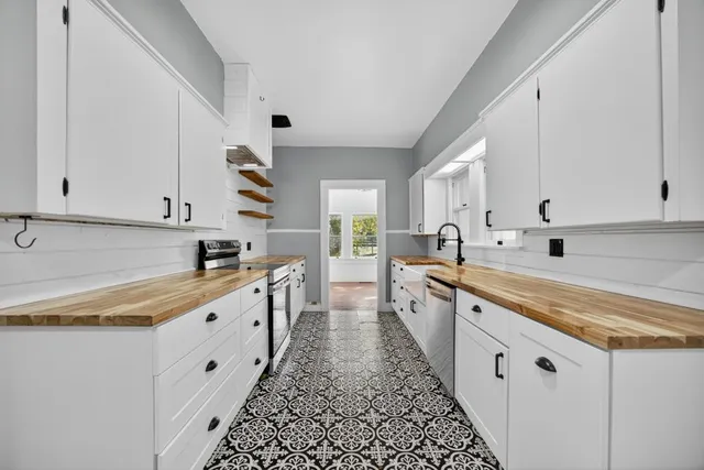a bathroom with a sink double vanity and a mirror