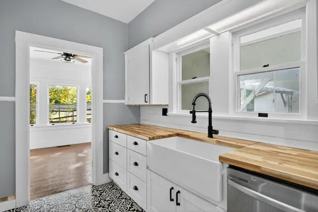 a view of a room with wooden floor and staircase