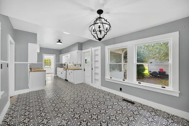 a view of a porch with wooden floor