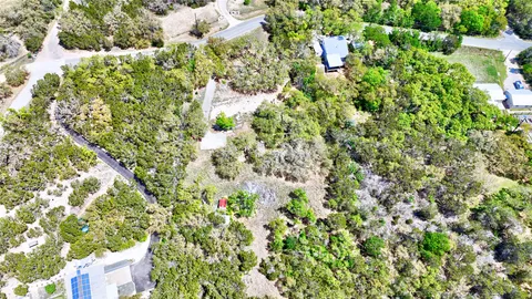 a view of a garden with a house