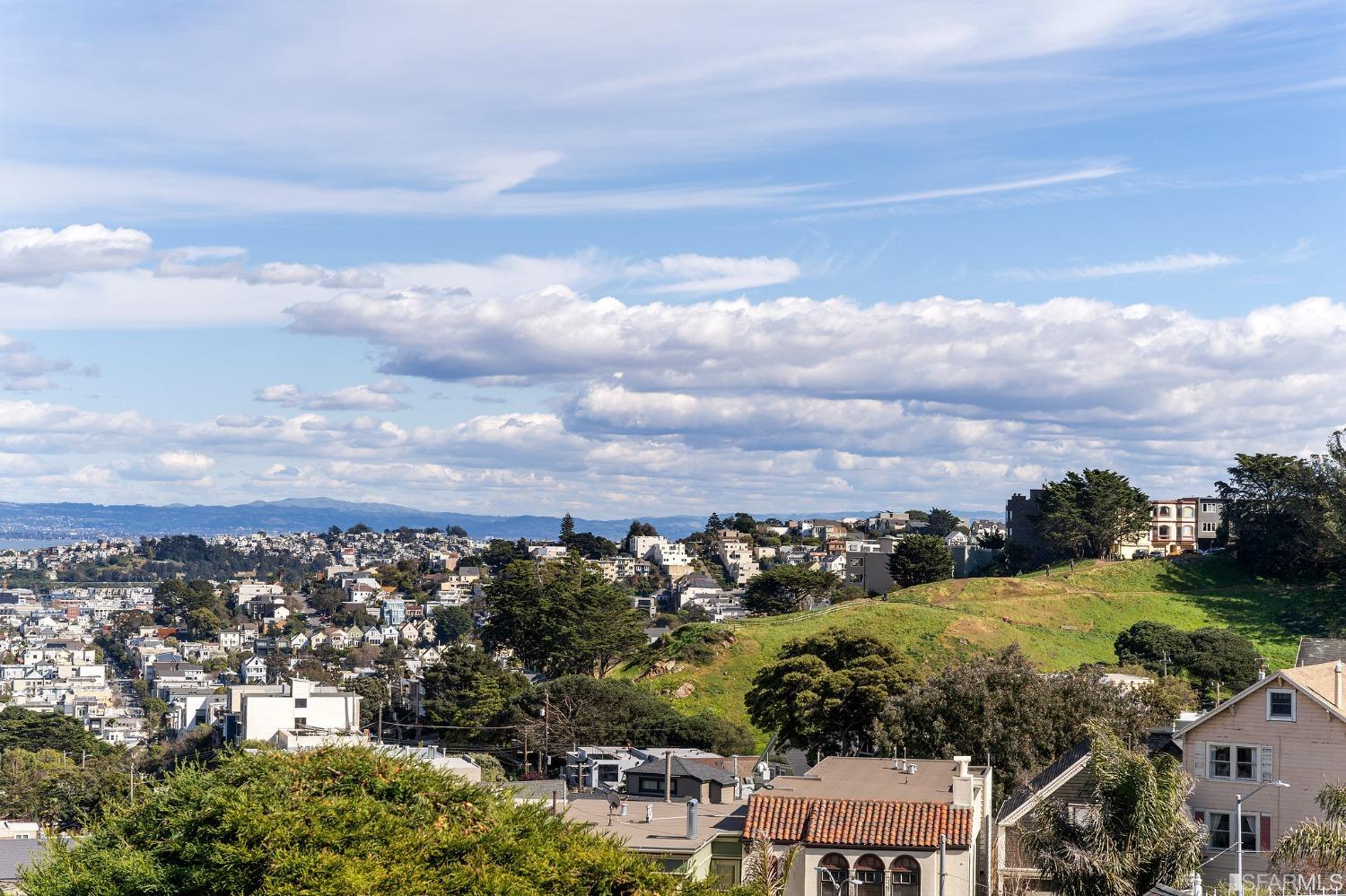 385 Corbett Avenue San Francisco, CA 94114 - Photo 24 of 72 an aerial view of residential houses with outdoor space and trees