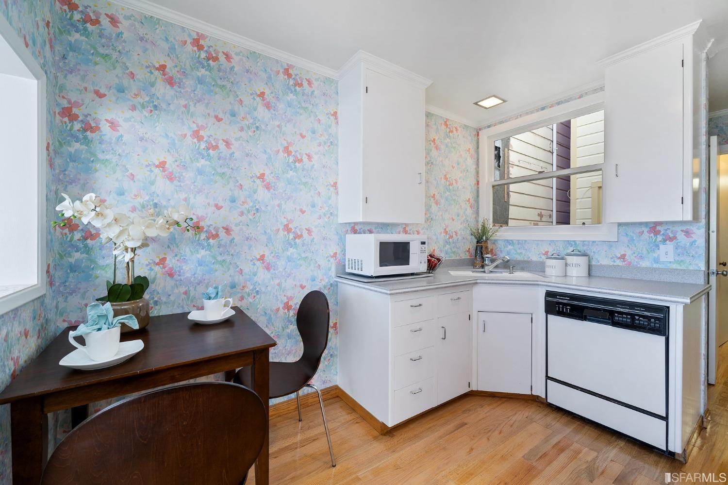385 Corbett Avenue San Francisco, CA 94114 - Photo 28 of 72 a kitchen with stainless steel appliances a sink a stove a window and cabinets