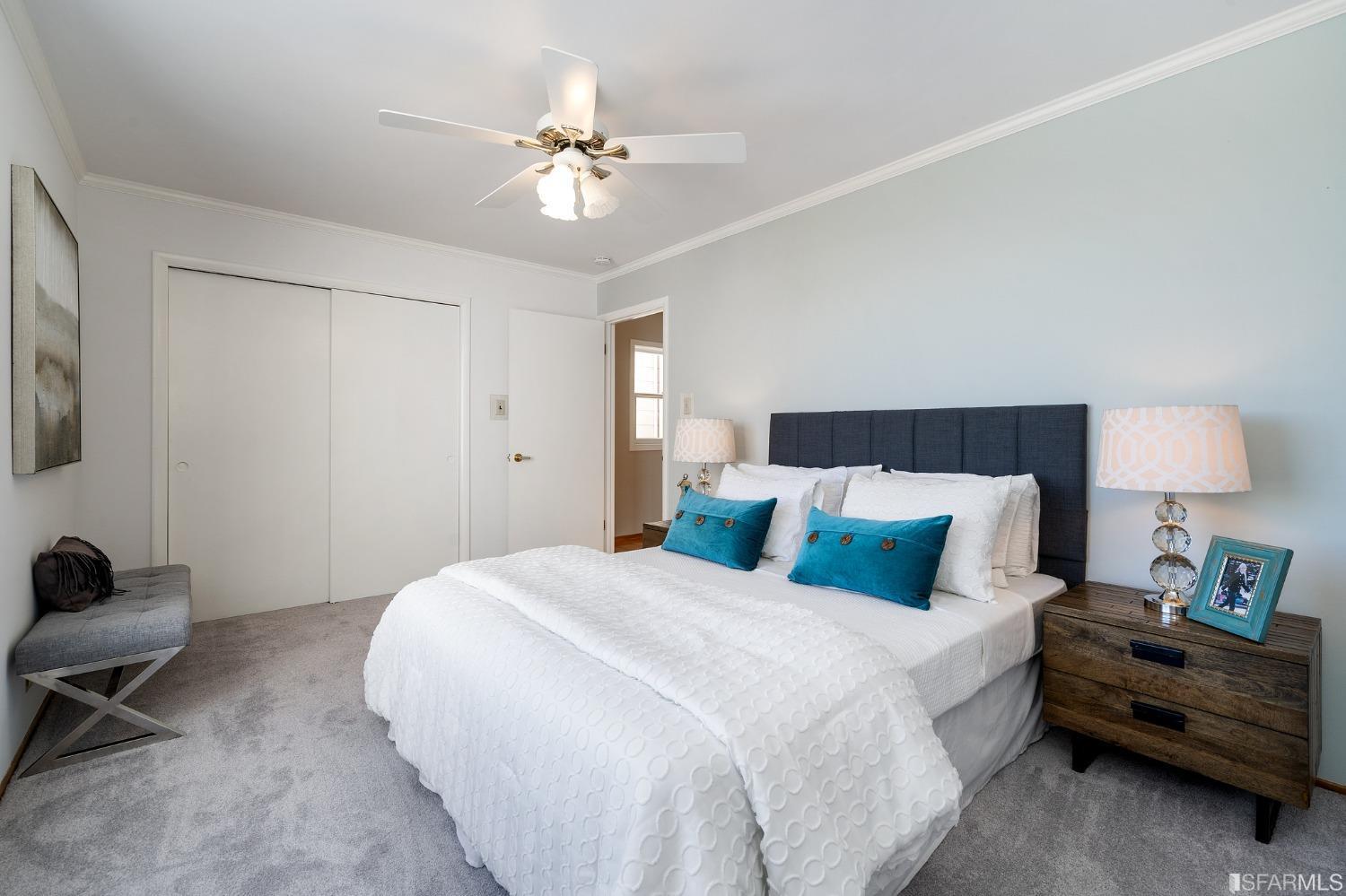 385 Corbett Avenue San Francisco, CA 94114 - Photo 34 of 72 a bedroom with a bed and a lamp on dresser