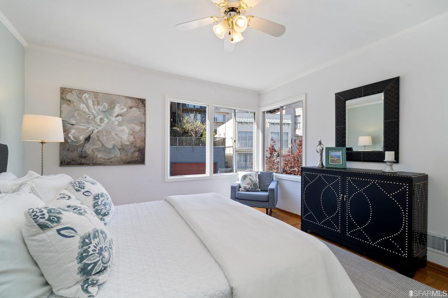 385 Corbett Avenue San Francisco, CA 94114 - Photo 39 of 72 a bedroom with a bed and a mirror on the dresser