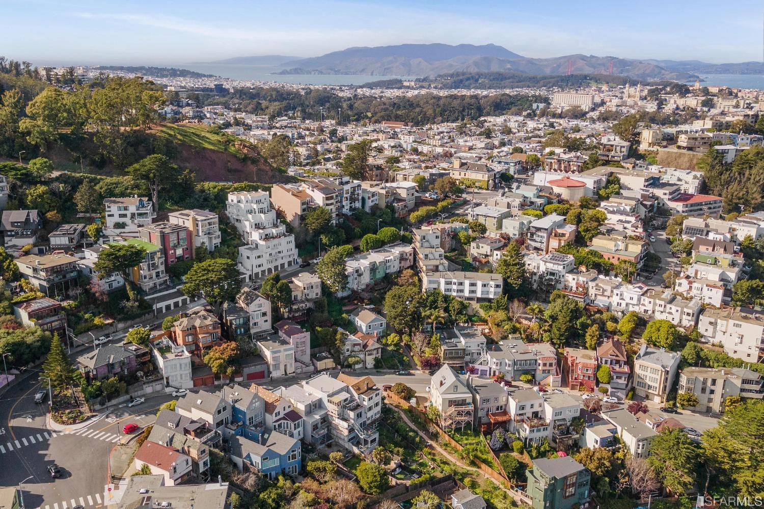 385 Corbett Avenue San Francisco, CA 94114 - Photo 67 of 72 an aerial view of a city with lots of residential buildings
