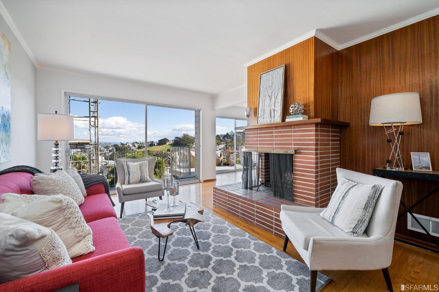 385 Corbett Avenue San Francisco, CA 94114 - Photo 10 of 72 a living room with furniture fireplace and a large window