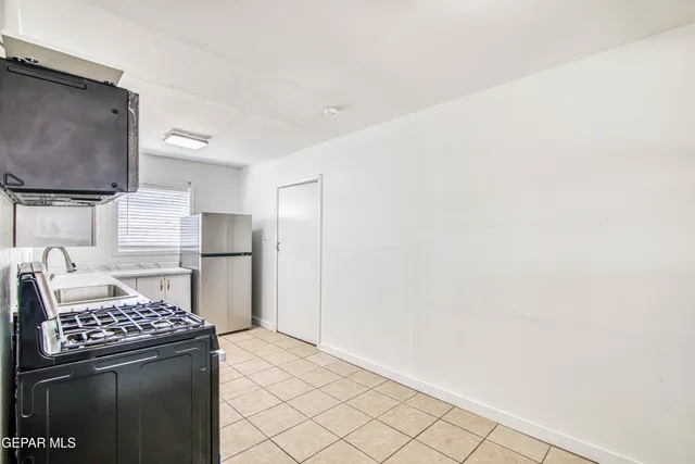 a kitchen with a sink cabinets and window