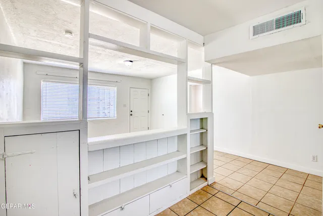 a bathroom with a toilet a sink and a mirror