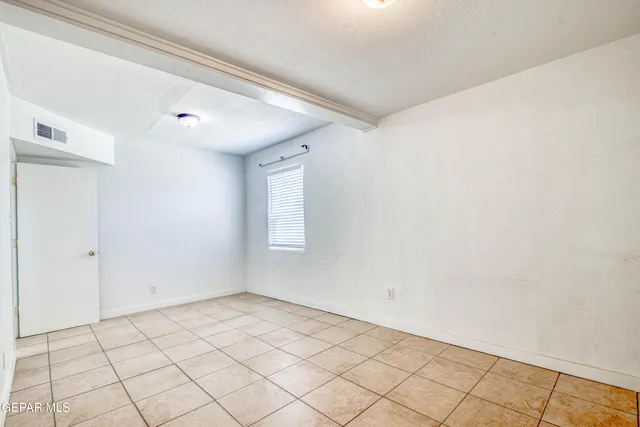 a kitchen with cabinets and stainless steel appliances