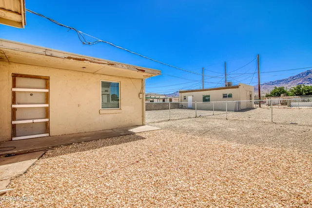 a bathroom with a sink mirror and vanity