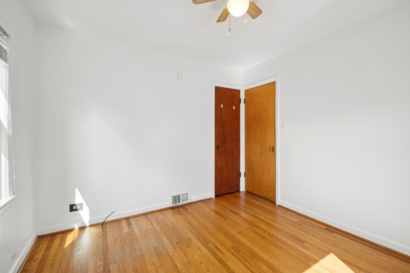 4631 North Lawler Avenue Chicago, IL 60630 - Photo 16 of 34 a view of an empty room with wooden floor
