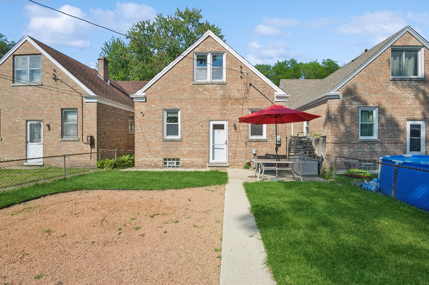 4631 North Lawler Avenue Chicago, IL 60630 - Photo 27 of 34 a front view of a house with a yard and porch