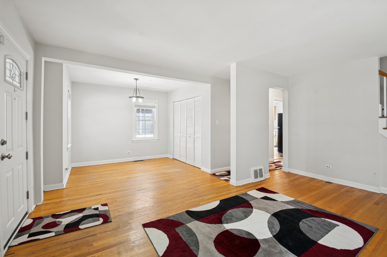 4631 North Lawler Avenue Chicago, IL 60630 - Photo 3 of 34 a bedroom with a bed and wooden floor