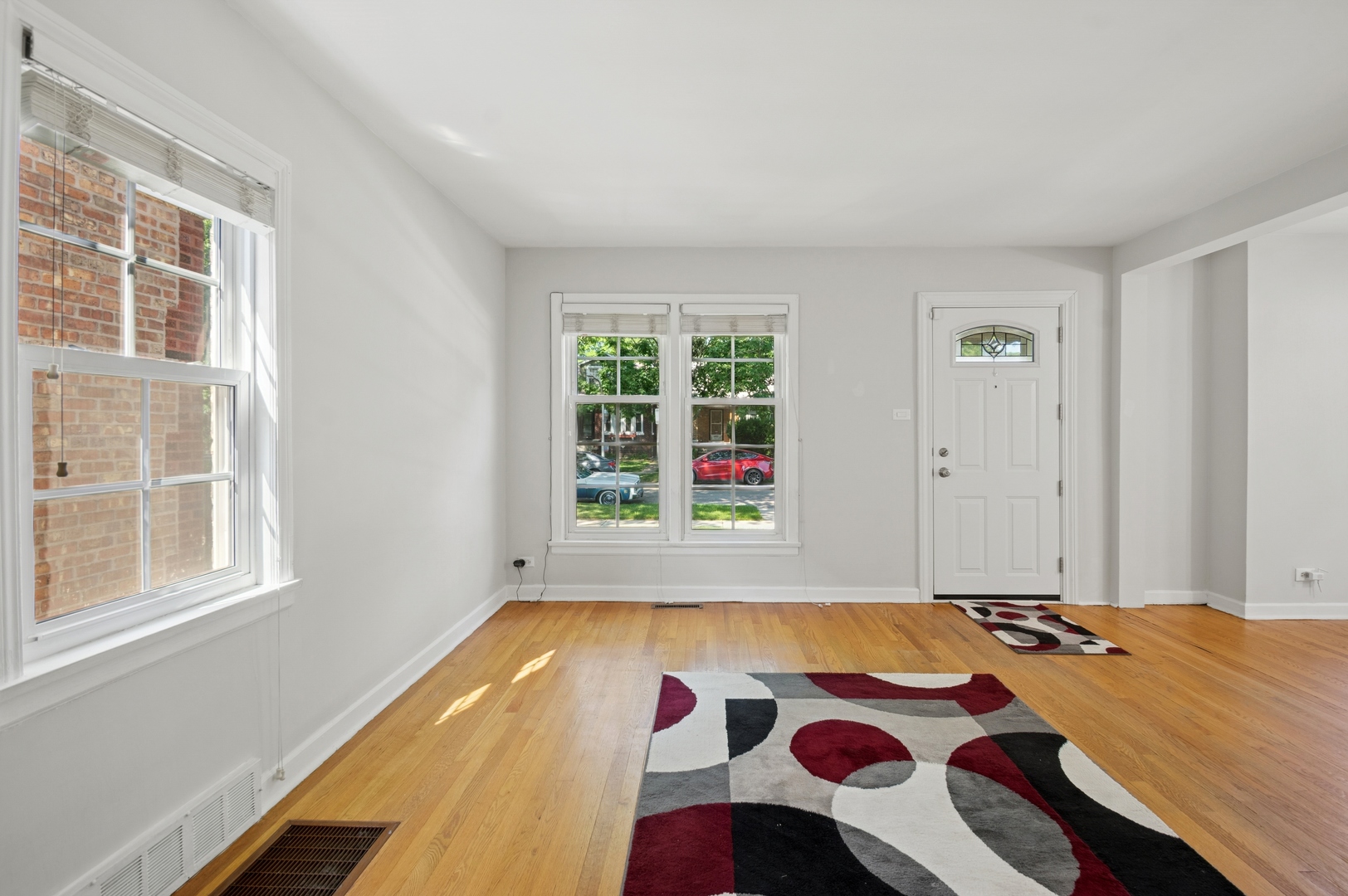 4631 North Lawler Avenue Chicago, IL 60630 - Photo 7 of 34 a bed sitting in a bedroom next to a window