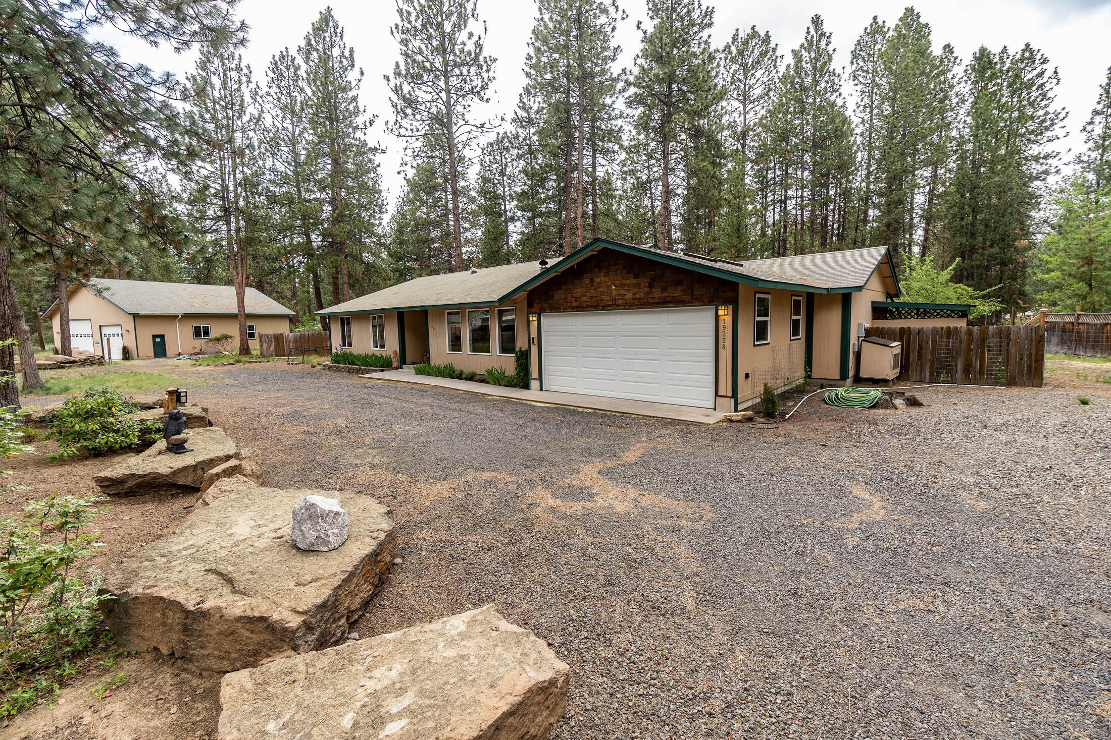 19258 Apache Road Bend, OR 97702 - Photo 1 of 23 a view of a house with a yard and large trees