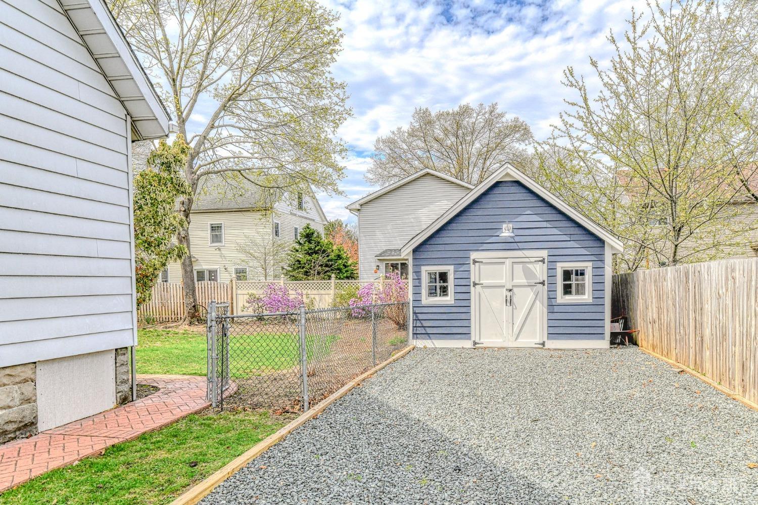 13 Howard Street Milltown, NJ 08850 - Photo 27 of 33 a view of a house with a yard and large tree