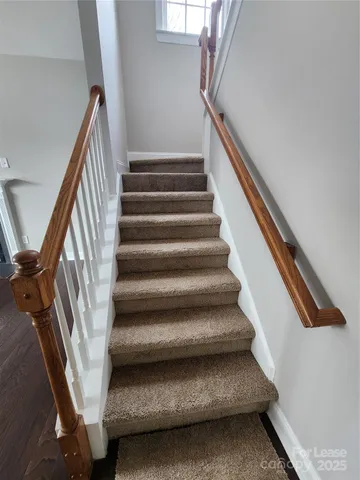 a view of a room with large windows and closet