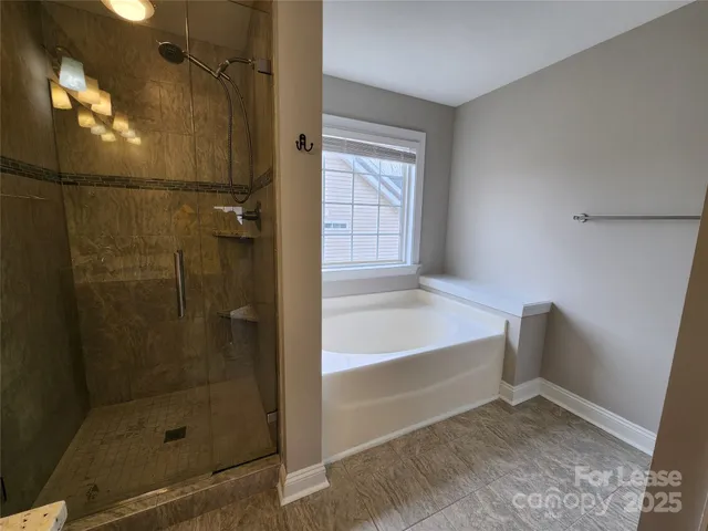 a white toilet sitting next to a white wall