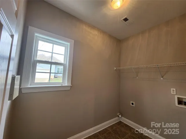 a kitchen with a stove a microwave and a refrigerator