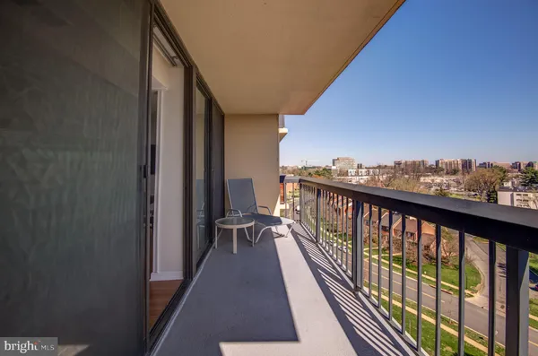 a view of balcony with furniture