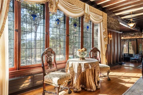 a living room with furniture a flat screen tv and a book shelf